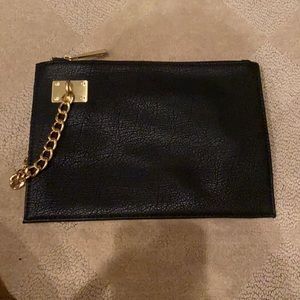 NWOT SR2 black leather clutch with chain detail.
